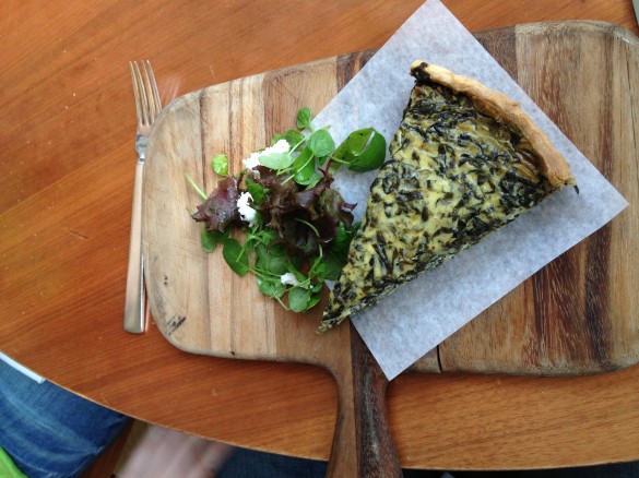 The Swiss Chard and Onion Tart, a delicate presentation that belies the richness of the dish.
